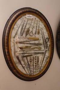 lot 135 image: Antique Button Hook Collection in Oval Frame - Intricate Handles