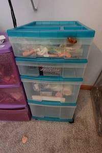 lot 335 image: Rolling Plastic Organizer with Doll Parts
