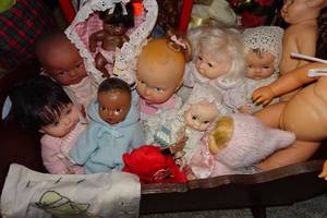 lot 389 image: Baby Dolls in Wood Bassinet