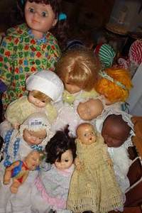 lot 391 image: Dolls with Metal Frame Bed