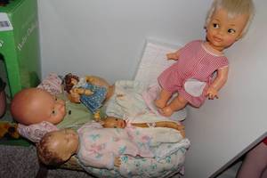 lot 404 image: Assorted Baby Dolls with Bassinet