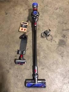 lot 7 image: Dyson V8 Cordless Stick Vacuum Cleaner  Customer Returns See Pictures