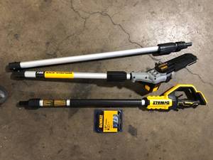 lot 24 image: DEWALT 20V MAX 8in. Brushless Cordless Battery Powered Pole Saw (Tool Only)     Customer Returns See Pictures