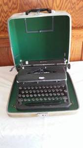 lot 10 image: Vintage Royal Quiet Deluxe Portable Typewriter.