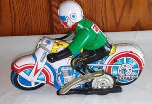 lot 12 image: Vintage Tin Toy Motorcycle Rider.