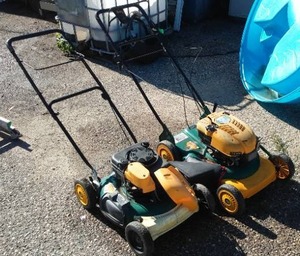 lot 292 image: Yardman lawn mowers (2) and Gas Cans (2).