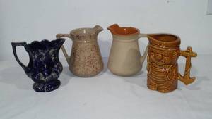 lot 317 image: Pottery Pitchers (4) Monmouth