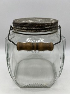 lot 127 image: Antique Embossed Glass Jar with Wood Handle Bail