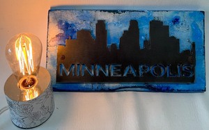 lot 345 image: Artisan Minneapolis Metal Art on Wood with Edison Bulb Table Lamp