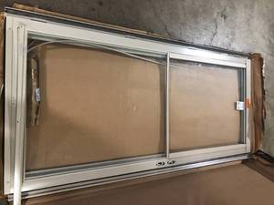 lot 35 image: Andersen 3000 Series 36 in. x 80 in. Sandtone Left-HandOutswing Full View Retractable Aluminum Storm Door  Customer Returns See Pictures