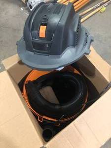 lot 46 image: RIDGID 12 Gallon 5.0 Peak HP NXT Shop Vac Wet Dry Vacuum with General Debris Filter, Locking Hose and Accessory Attachments  Customer Returns See Pictures