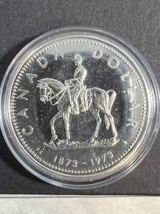 1973 CANADIAN MOUNTED POLICE SILVER DOLLAR IN AIRTITE