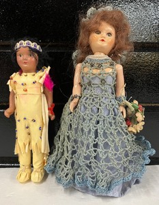 lot 77 image: Two Vintage Home Inc Dolls Indian Girl and Girl with Flowers