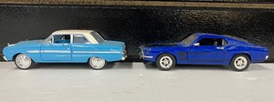 lot 83 image: Two Vintage Diecast Cars 1969 Ford Boss Mustang and Ford Falcon Futura