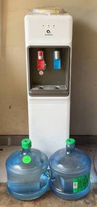 lot 63 image: Avalon HotCold Water Cooler With Bottles Of Water