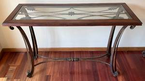 lot 124 image: Small Ornate Metal And Wood Table With Glass Top 48 L x 32 H x 18 W