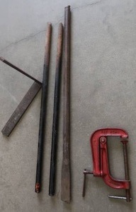 lot 10D image: PICK, TWO HEAVY STEEL RODS, A STEEL L BRACKET, CLAMP