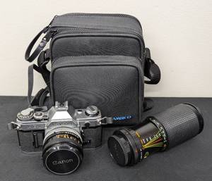 lot 184 image: Canon AE-1 SLR 35mm Camera and Accessories