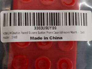 Three HOWLUM Double-Faced Silicone Suction Phone Case Adhesive Mounts in Red