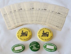 lot 723 image: Collectible Vintage Burlington Northern Railroad Veterans Pin-Backs, Time-Cards Etc.
