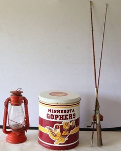 lot 735 image: Vintage Winged Wheel Red Lantern Made In JAPAN No. 500, Minnesota Gophers Empty Popcorn Tin, Fishing Rod