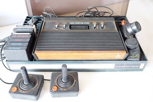 lot 919 image: Atari CX-2600 Super System Console wGames, Joysticks and Paddles (1980) Stored in Compact Game Console