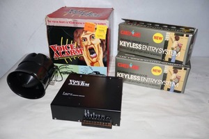 lot 931 image: Genie Keyless Entry System, Voice Alarm Security System