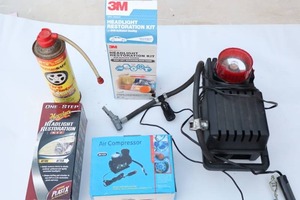 lot 964 image: Auto Accessories...12V Tire Inflator wGauge Flashing Red Light and Bright Light, Headlight Restoration Kits, Mini Air Compressor Etc