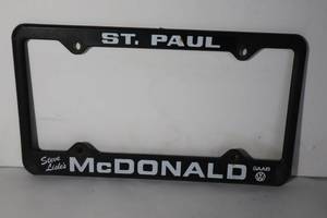 lot 133 image: Vintage St. Paul Steve Lisles McDonald SAAB License Plate Holder