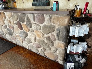 lot 245 image: Very Large Stone Front Desk Measuring 12-12 Feet W by 30 inches Deep by 44 inches High - Buyer to remove