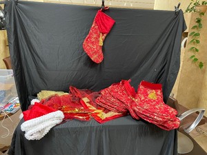lot 155 image: 32 Christmas Stockings, 7 Stocking Hooks, and 9 Table Runners
