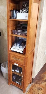 lot 26 image: Wooden Bathroom Linen Tower Cabinet with 1 Drawer and 3 Adjustable Interior Shelves and 6 Storage Spaces in Oiled Oak.  Measuring 17 inches W by 13-12 inches D by 65 inches H. Shelf only, contents not included