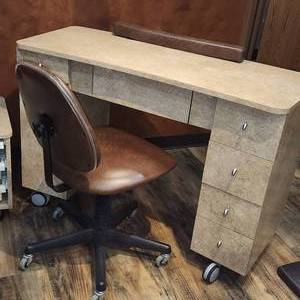 lot 64 image: Rolling Belvedere Manucure Station with locking Casters and Leather Bomber Rolling Chair. Station Measures 48-14 inches W by 21 inches D by 32-34 inches H with Wheels29 inches without. One of 2.