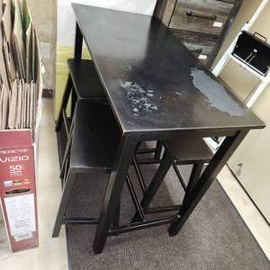 lot 78 image: Pub High Top Rectangular Table with Four Bar Stools in Black Measuring 44 inches W by 22 inches D by 36 inches H