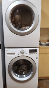 lot 89 image: LG Front Loading Washer and Gas Dryer that Can be Stacked with 1 Kit - Measuring 38 inches W by 38 inches D v 74 inches H. One of 2.