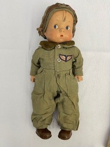 lot 8 image: Rare WWII Army Skippy Aviator Air Corps Doll in Government Issued Air Corps uniform and goggles Childs Doll in like new condition and Baby Girl Doll in Nightgown. Estimate Value $1,200-$1,400.