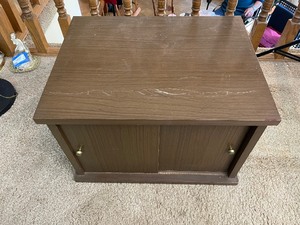 lot 16 image: Mid-Century Modern Cabinet with Sliding Doors. 22 Inches Wide by 17 Inches Deep by 15 Inches High.