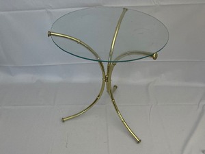 lot 35 image: MCM Gold and Glass 3 Leg Side Table. Estimated Value $100-150. 15 Inches Diameter by 17 Inches Tall.