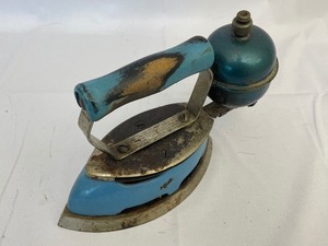 lot 41 image: Antique Coleman Instant Lite Iron. Estimated Value $60-120