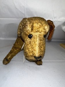 lot 229 image: Antique Stuffed Animal Dog.