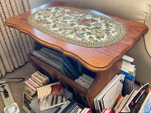 lot 98 image: Wood End Table and Magazine Rack All in One. Includes Books in Table and Table Runner.