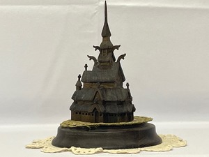 lot 126 image: Vintage Hennig Hand Varved Borgund Stave Church. Hand Carved by Henning of Norway. Comes with Wood Stand and Doilies. Estimated Value $125-150