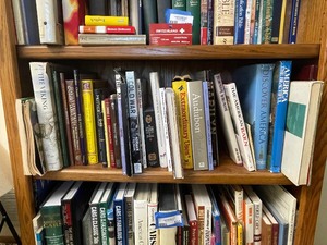 lot 132 image: Middle Shelf of Books as Seen in Photo.