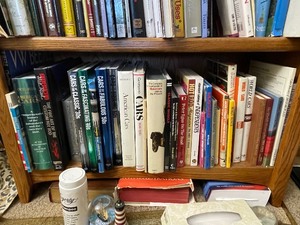 lot 133 image: Bottom Shelf of Books as Seen in Photo.