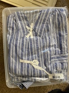 lot 157 image: Bin of New and Used Pajama Tops and Bottoms.