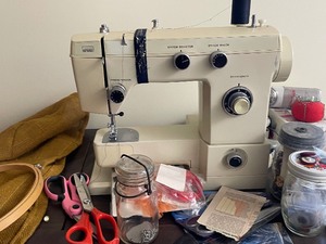 lot 174 image: Montgomery Ward Sewing Machine and Table with All Sewing Supplies as Seen in Pictures. Also Bench Included.