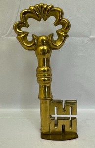 lot 186 image: Cast Brass Key Doorstop.