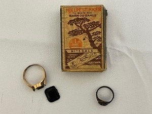 lot 188 image: Two Naval Rings in Vintage Matchbox.