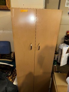 lot 506 image: Metal Closet, Measuring Width (unspecified) and 60 Inches Tall.