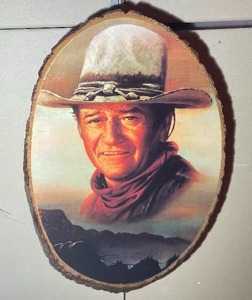 lot 468 image: John Wayne Tree Slab Art Measuring 10 Inches by 7 Inches.